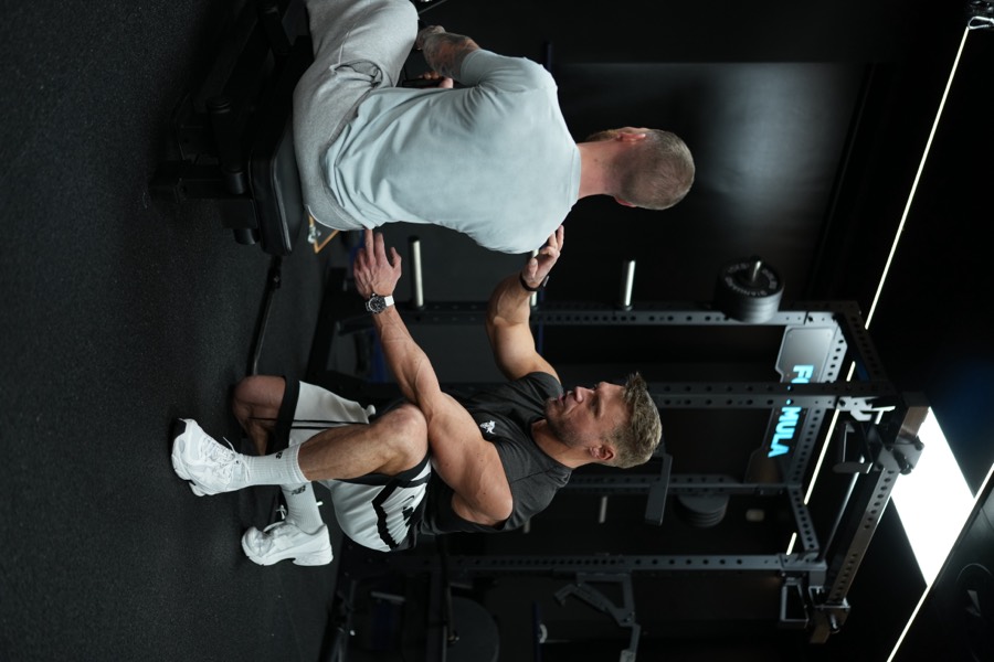 Gary coaching a client through a seated row at the Formula gym